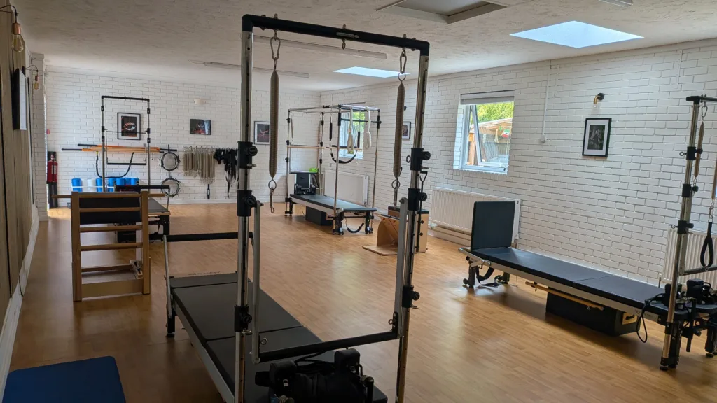 Empty Pilates reformer studio in Broadstone showing Cadillac, reformer and tower equipment
