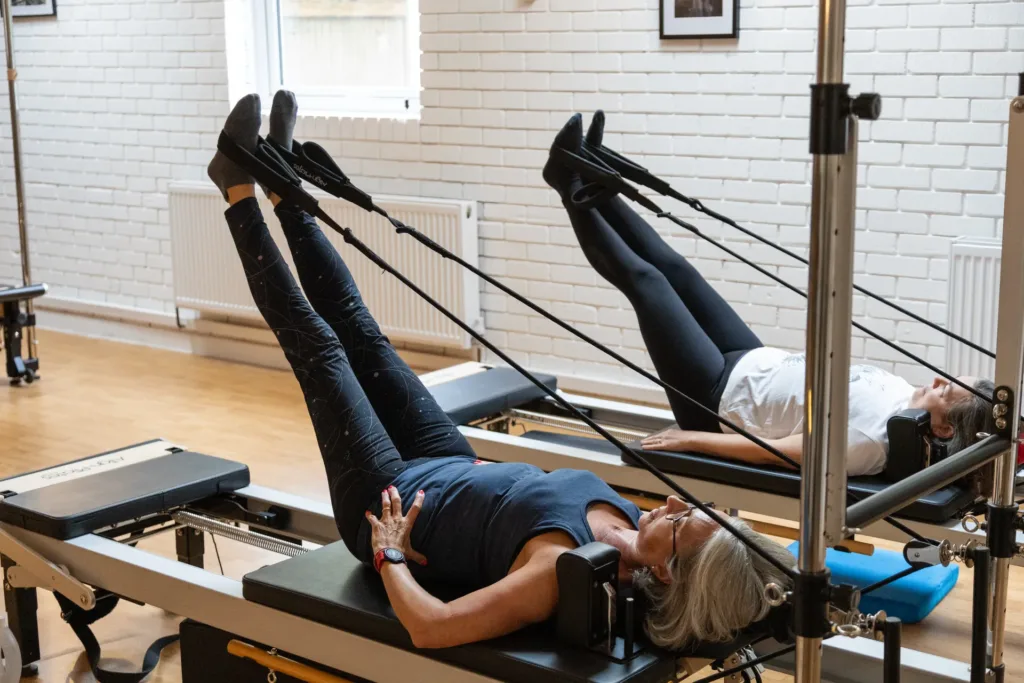 Small-group Reformer Pilates class in progress at THRIVE Studio, Broadstone